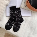 Cute black crew socks with white cat and fishbone jacquard patterns and meow text - One Size / Black