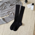 Classic black ribbed cotton knee-high socks for women with a vertical knit texture - One Size / Black