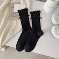 Black knit crew socks with ruffled edges, delicate bows and button accents in a sweet style - One Size / Black