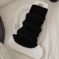 Zwarte gebreide beenwarmers voor dames met verticale ribbels en ruches aan de rand - Zwart