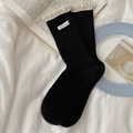 Black ribbed crew socks with white lace trim and embroidered letter patch for women - One Size / Black