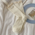 Cream knit mid-calf socks with delicate lace trim and 'Own the moment' woven tag - One Size / Cream