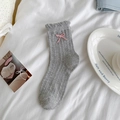 Light grey knitted crew socks with pink bow accent and hollow wave patterns - Lattice Pattern Grey