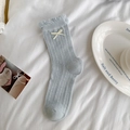Light blue-grey cable knit crew socks featuring ruffled edges and cream bow detail - Lattice Pattern Blue