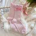 Pink crew socks with sweet bow detail, ruffled cuffs, and elegant cable knit pattern - Twist Pattern Pink