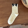Cream ribbed mid-calf socks featuring black bow jacquard patterns for a sweet retro look - Cream Bow Style