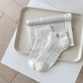 White ankle socks with cute bear embroidery and ribbed texture on beige tray - One Size / White