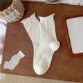 White Japanese crew socks with heart-shaped eyelet pattern and ruffled wave cuff - Rolled Edge