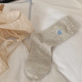 Grey knitted crew socks with a small blue heart embroidery on a white background - Blue Embroidered Heart