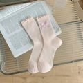 Rosa gerippte Damensocken mit karierter Schleife und Rüschenrand auf Buch - Rosa (1 Paar)