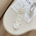 Chic cream-white ribbed knit leg warmers with stirrup design and trendy slouchy effect - Off White