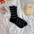 Women's black and white striped crew socks featuring elegant white lace mesh trim cuff - One Size / Black
