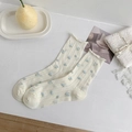 Cream crew socks with blue floral print, ribbed knit texture and ruffled cuffs - White Floral Pair