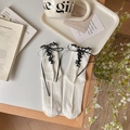 Chaussettes blanches Lolita avec bordure en dentelle noire et nœud à l'arrière - Taille unique / Blanc