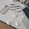 Calze beige con bordo a balze marroni e trama a costine verticali a maglia - Taglia unica / crema