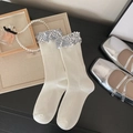 Cream knit mid-calf socks with sparkly silver sequins at the cuff for a retro style - One Size / White