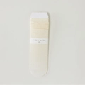 Lace mesh slouch socks in cream white with minimalist paper packaging wrap - One Size / Milk Yellow