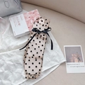 Sheer beige tulle socks with black polka dots and a delicate bow tie accessory - Brown