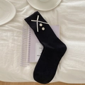 Chaussettes mi-hautes noires à côtes avec nœuds blancs et boutons décoratifs - Taille unique / Noir