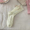 Cream knit mid-calf crew socks with sweet bow detail and colorful speckled snowflake pattern - One Size / Yellow (With Flecks)