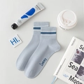 Light blue striped ankle socks with Tammy lettering and breathable cotton texture - One Size / Blue