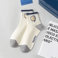 White crew sock with yellow smiley face embroidery and peaceful letter print - Smiley Face / White