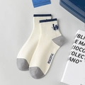 Off-white cotton crew socks with peaceful lettering and blue striped athletic accents - Alphabet / White