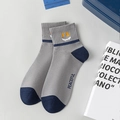 Grey combed cotton crew socks with blue contrast toe and yellow peaceful smiley face - Smiley Face / Gray