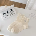 Creamy white crew socks with grey butterfly embroidery and stylish rolled edge cuff - One Size / Khaki