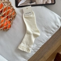 Milky white mid-calf socks featuring waffle knit cuffs and elegant lace bow accents - One Size / Creamy White