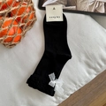 Black mid-calf cotton socks featuring elegant white lace bow accents and brand tag - One Size / Black