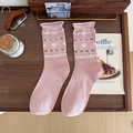 Pink mid-calf knit socks with white hearts and black bows on a rustic wooden tray - One Size / Pink