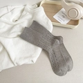 Grey cable knit socks for women featuring ribbed cuffs and thick thermal fabric - One Size / Light Gray