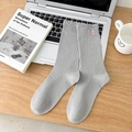 Grey ribbed crew socks with pink bow embroidery on a cozy wooden desk setting - Light Gray (1 Pair)