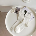 Chaussettes blanches à côtes avec bordure volantée double et nœud noir - Taille unique / Blanc