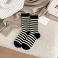 Classic black and white striped crew socks with ribbed cuffs and reinforced heels - One Size / Black
