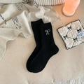 Black knitted wool socks with white bow embroidery and comfortable ribbed cuffs - Black
