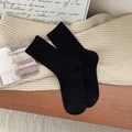 Thick winter thermal crew socks in black featuring a classic vertical ribbed knit texture - Black
