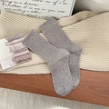 Mid-calf ribbed grey winter socks in thick knit displayed on a cozy wooden surface - Khaki