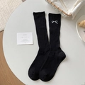 Chaussettes côtelées noires en coton pour femmes avec broderie nœud blanc élégante - Taille unique / Noir