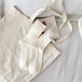 Cream white ribbed cotton crew socks featuring cute pompom detail and woven label - White Heart Style