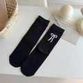 Chaussettes femme en coton noir avec nœud blanc en peluche et style collège vintage - Taille unique / Noir