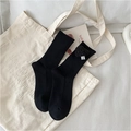 Women's black cotton crew socks featuring a cute 3D plush flower charm and ribbed texture - Black Heart
