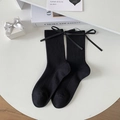 Classic black crew socks with ribbed texture and silk bow detail on white background - Black Bow