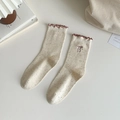 Cream knit mid-calf socks with colorful confetti pattern and red ruffled bow details - Rose Red Bow