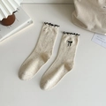 Off-white speckled crew socks with black bow embroidery and ruffled edges detail - Black Bow