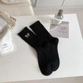 Elegant black mid-calf socks with silver rhinestone bows and fine ribbed knit texture - One Size / Black