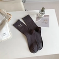 Dark grey ribbed mid-calf socks featuring a sequined bow and delicate knit texture - One Size / Gray