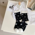Women's crew socks with black and white camellia rose patterns and stylish bow accents - One Size / Black Camellia
