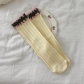 Creamy yellow ribbed cotton crew socks with dark green ruffled cuffs and pink trim - Yellow